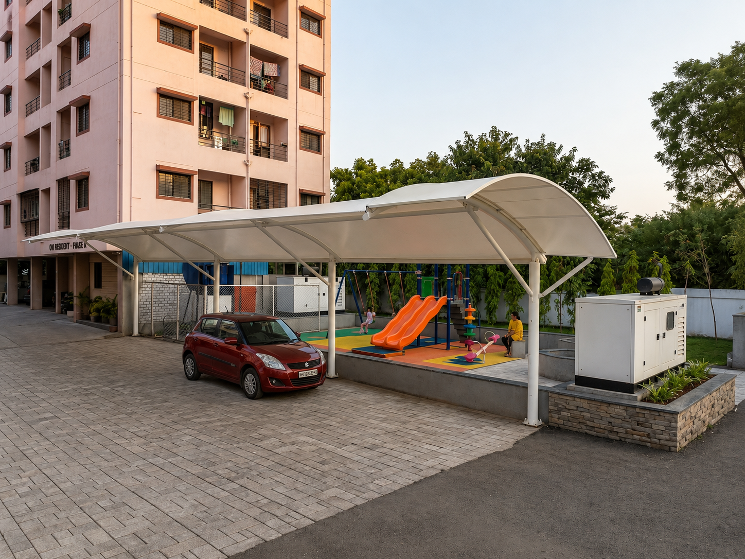 Tensile car parking shed with a children's play area in a housing society